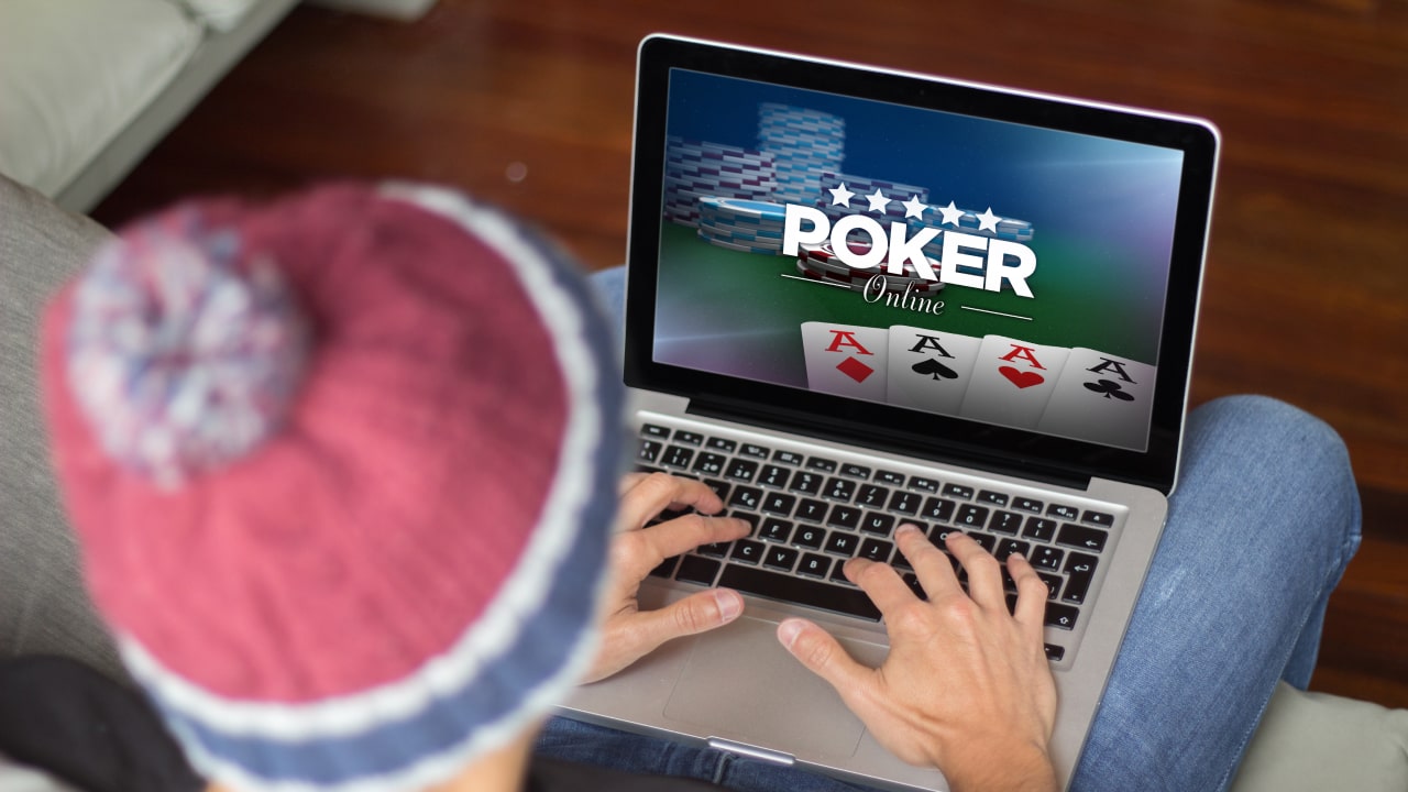 man playing online poker at online casino